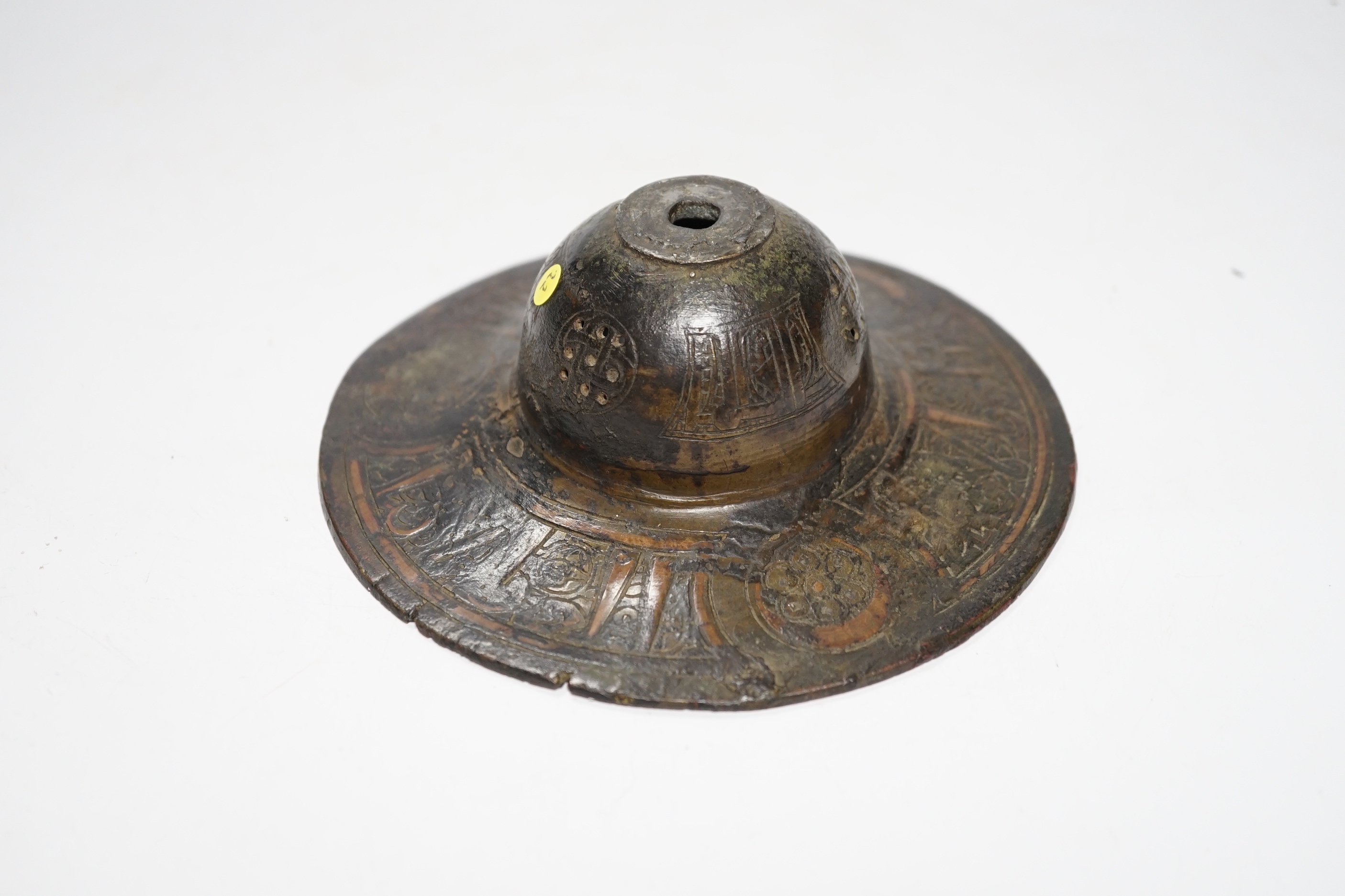 An early Islamic bronze and copper inlaid shield or door boss, probably 12th/13th century, 14.5cm